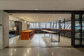 Seattle apartment for rent - A modern dining area with a long table and chairs.