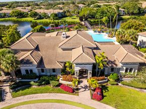 Palm Beach Gardens apartment for rent - A large house with a pool in the backyard.