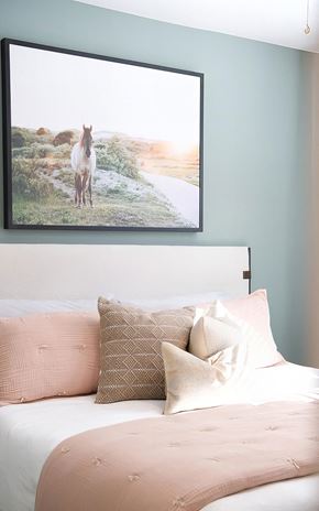 Cary apartment for rent - Spacious bedroom with tall ceilings and light green accent wall at Novel Cary