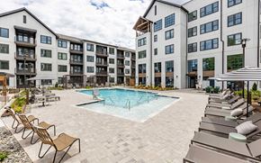 Cary apartment for rent - Incredible inground saltwater pool with abundant seating at Novel Cary