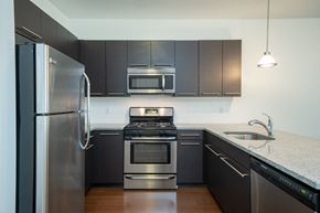 Stamford apartment for rent - Kitchen with stainless steel appliances and granite countertops at 163 Franklin Street Apartments, Connecticut