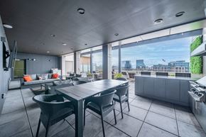 Stamford apartment for rent - Rooftop dining area with covered patio and grill at 66 Summer Street Apartments, Stamford, CT 06901