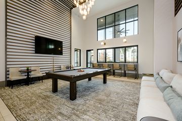 Daytona Beach apartment for rent - A living room with a pool table and a television.