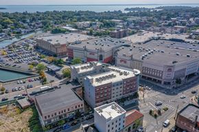 Port Chester apartment for rent - Aerial view of community and surrounding shopping center at Port & Main Apartments, Port Chester, NY 10573