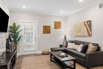 Kingsland apartment for rent - A living room with a brown couch and a coffee table.