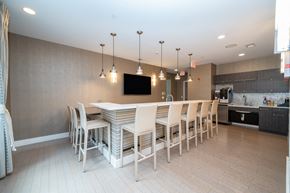 Stamford apartment for rent - Community kitchen with bar seating and pendant lights at 750 Summer Street Apartments, Connecticut, 06901