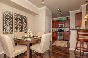 Dallas apartment for rent - A dining room with a table set for four.