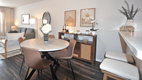 Plano apartment for rent - A dining room with a round table and chairs.
