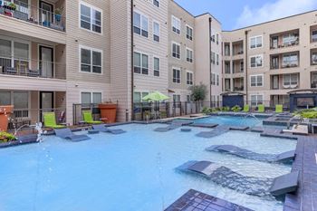 Large swimming pool with lounge chairs