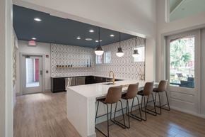 Houston apartment for rent - a kitchen with a white counter and chairs