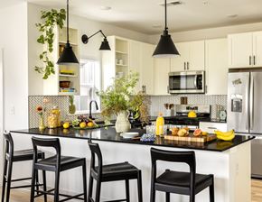 East Hanover apartment for rent - A kitchen with black chairs and a black countertop.