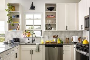 Ewing Township apartment for rent - A kitchen with white cabinets and a black faucet.