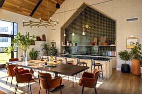 Ewing Township apartment for rent - A modern dining room with a wooden table and chairs.