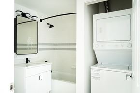 Jersey City apartment for rent - a white washer and dryer and a mirror in a bathroom
