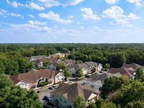 Jackson apartment for rent - a aerial view of a neighborhood with houses and trees