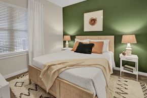 Rockaway Township apartment for rent - a bedroom with a bed and a green wall and a window