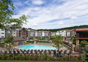 Rockaway Township apartment for rent - an aerial view of an apartment complex with a swimming pool