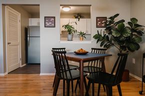 Branchburg apartment for rent - a dining room with a table and chairs and a refrigerator