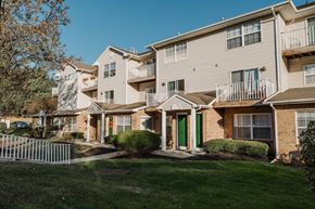 Branchburg apartment for rent - an apartment building with a yard and green grass