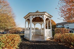 Branchburg apartment for rent - a white gazebo with a wooden deck in a yard