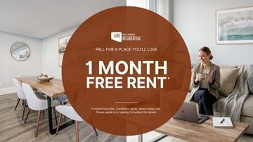 Toronto apartment for rent - A woman is sitting on a couch with a laptop on a coffee table in front of her.