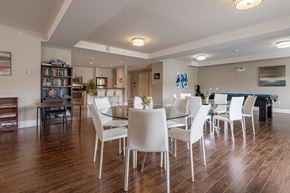 Bedford apartment for rent - a dining room with a glass table and chairs and a pool table