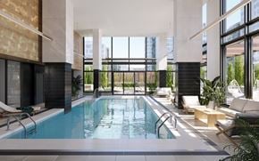 Montreal apartment for rent - A large indoor swimming pool with lounge chairs and plants.