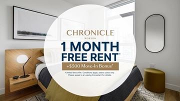 Vancouver apartment for rent - A bedroom with a bed, nightstand, and lamp, advertising a 1 month free rent offer.