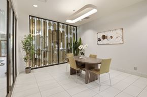 Edmonton apartment for rent - A dining room with a table and chairs.