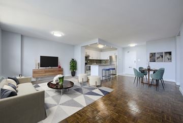 Toronto apartment for rent - A living room with a wooden coffee table and a grey sofa.