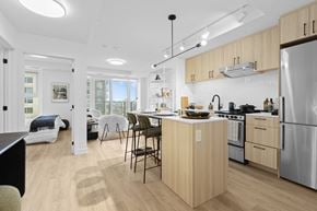 Ottawa apartment for rent - A modern kitchen with wooden cabinets and stainless steel appliances.