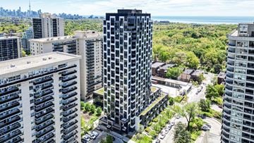Toronto apartment for rent - A cityscape with a mix of residential and commercial buildings.