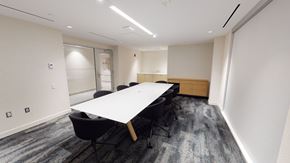 Toronto apartment for rent - A conference room with a long table and chairs.
