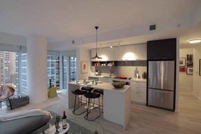 Toronto apartment for rent - A modern kitchen with a dining table and chairs.