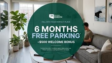 Edmonton apartment for rent - A man is sitting on a couch in a living room with a large green circular sign offering 6 months free parking and a $500 welcome bonus.