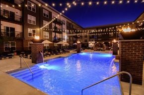 Columbus apartment for rent - A lit up pool area at night.