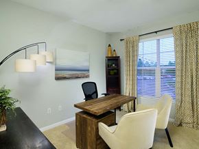 Columbus apartment for rent - A dining room with a wooden table and chairs.