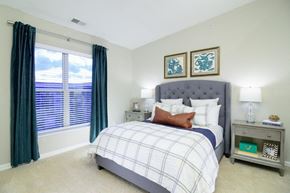 Columbus apartment for rent - a bedroom with a large window and a bed at Taylor House Apartments, Columbus, OH, 43214