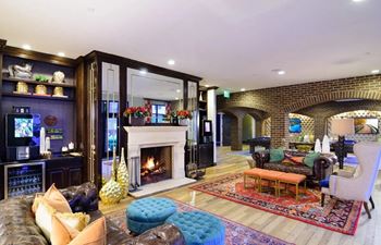 A living room filled with furniture and a fire place