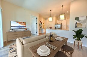 Columbus apartment for rent - A modern dining room with a wooden table set for two.