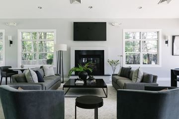 Mansfield apartment for rent - A modern living room with a fireplace and a television mounted above it.