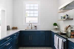 Mansfield apartment for rent - A kitchen with dark blue cabinets and a black stove top oven.