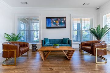 Summerville apartment for rent - A living room with a brown leather chair and a wooden coffee table.
