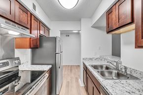 Irving apartment for rent - a kitchen with granite counter tops and stainless steel appliances