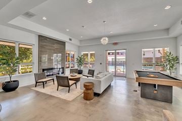 Savannah apartment for rent - A spacious living room with a pool table and a view of the outdoors.