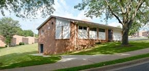 Lynchburg apartment for rent - a house that has been boarded up with white curtains