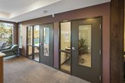 Andover apartment for rent - a conference room with glass doors and a table and chairs