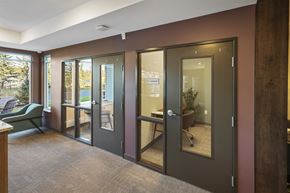 Andover apartment for rent - a conference room with glass doors and a table and chairs