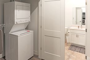 Owatonna apartment for rent - A white microwave oven is on top of a white dishwasher in a kitchen.