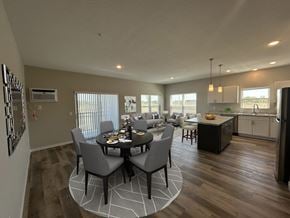 Baxter apartment for rent - A dining room with a table set for six with a kitchen in the background.